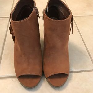 Never worn peep toe booties with fringe.